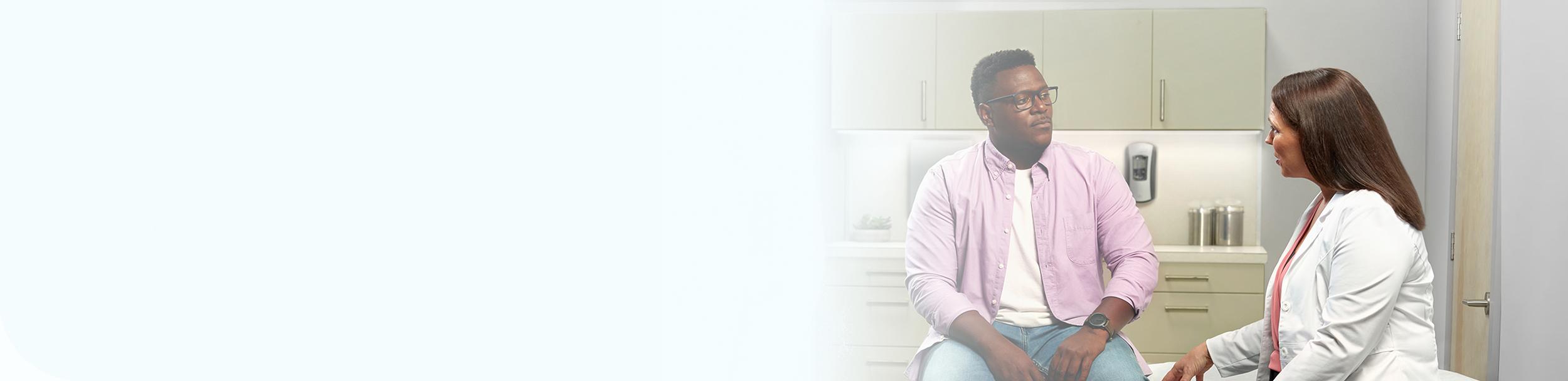 Male patient with narcolepsy speaking with doctor about XYWAV