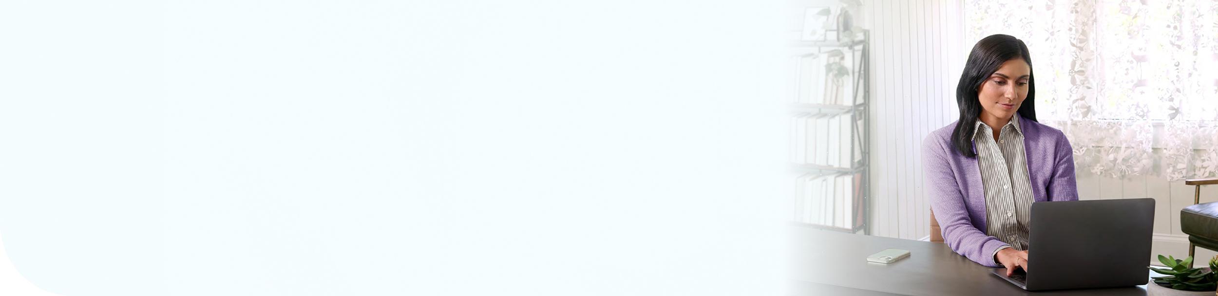 A patient working on her laptop.